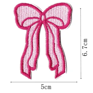 Pink bow embroidered patch, cute clothing decorative accessory for DIY sewing crafts.