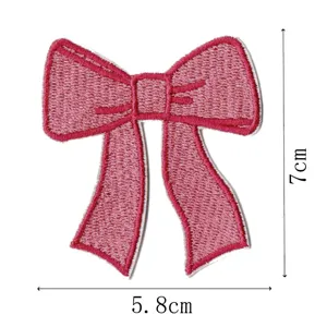 Pink bow embroidery patch, fabric decorative applique with clear size details for clothes.