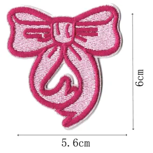 Pink bow embroidered patch detail shot, cute clothing bag hat DIY decoration applique.