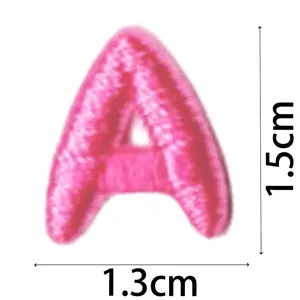 Cute pink embroidered letter A patch detail view, mini DIY decorative clothing accessory 1.5cm size.