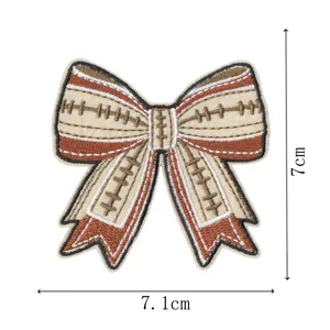 Brown and beige football pattern bow embroidery patch for clothing decoration details.