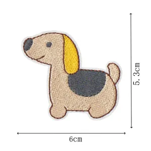 Cartoon dog embroidery patch detail view showing measurements and fine stitching work.