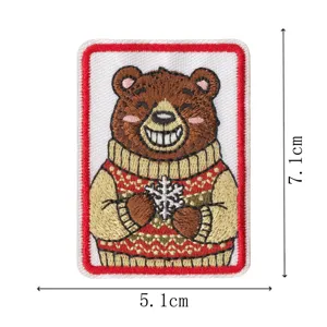 Christmas brown bear embroidered patch with red border, festive clothing accessory badge.