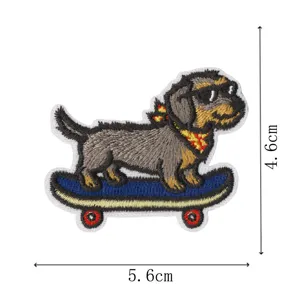Detailed view of cute skateboard puppy embroidered patch, iron-on sew-on fabric badge DIY decor.