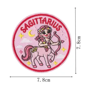 Retro aesthetic Sagittarius zodiac embroidered patch detail with pink background and clear size.
