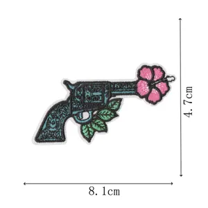 Western style gun embroidery patch with flower design, perfect for clothing and hats.