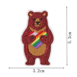Embroidered bear patch with rainbow heart, cute cartoon clothing iron-on applique detail.