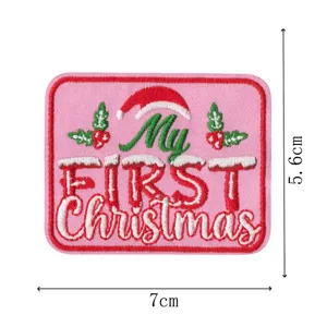 Christmas embroidered patch with 'My FIRST Christmas' text and Santa hat design, 7x5.6cm.