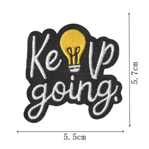 Dekorativer Aufbügler mit Keep Going Stickerei und Glühbirne für Taschen und Kleidung.
