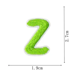 Green letter Z embroidered patch detail, miniature clothing DIY decoration and repair accessory.