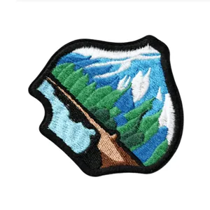 Outdoor landscape embroidered patch with mountains and trees for jackets and clothing decoration.