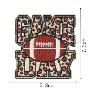 Leopard print football embroidered patch detail shot, cute cartoon garment accessory badge.