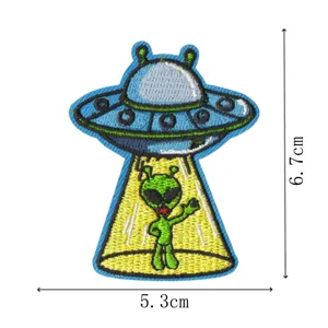 Detailed shot of UFO alien embroidered patch, showing precise dimension and fine stitches.