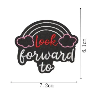 Detailed view of the cute embroidered cloth patch featuring rainbow and inspirational text.