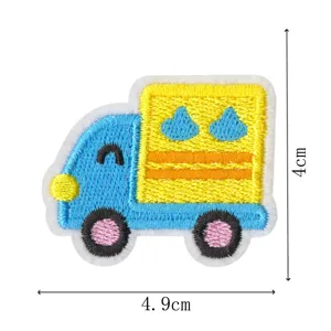 Cute cartoon blue truck embroidered patch detail, fabric applique for clothing repair decoration.