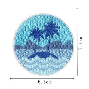 Round tropical island embroidered patch detail, blue ocean and palm trees, iron on craft.