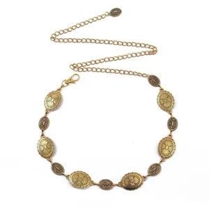 Vintage gold metal waist chain detail featuring ornate oval medallions and lobster clasp.