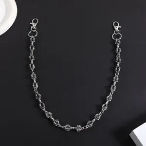 Gothic punk metal pant chain detail, edgy streetwear accessory with intricate link design.