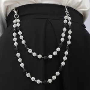 Detail shot of double-layer rhinestone pants chain, sparkling disco balls waist hanging accessory.