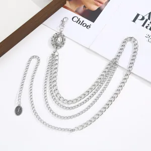 Detailed view of a multi-layer silver waist chain, featuring delicate vintage charms.