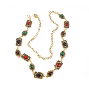 Catena da vita dorata vintage con pietre preziose colorate e strass per eleganti abiti.