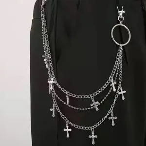 Punk hip-hop multi-layer metal waist chain with cross pendants, edgy streetwear pants.