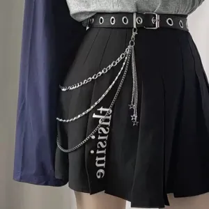 Punk style multi-layer metal waist chain with black pleated skirt and belt for street fashion.