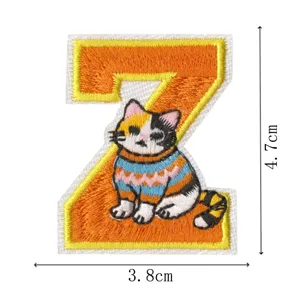 Embroidered letter Z cat patch detail, cute calico kitten design, clothing accessory 3.8x4.7cm.