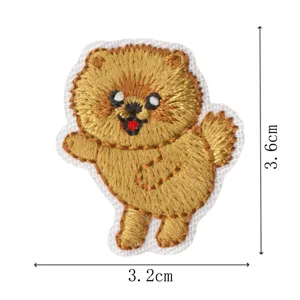 Cute puppy embroidered patch detail view, high quality iron-on badge for clothes and bags.