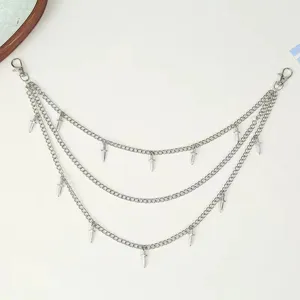 Gothic metal pants chain detail shot, multi-layer waist chain with unique dagger pendants.