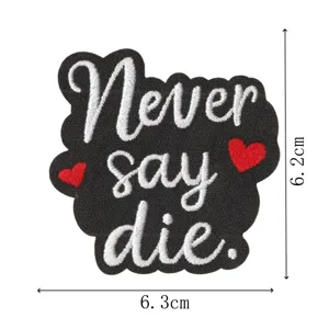 Black embroidered patch with Never say die text and red hearts, clothing DIY accessory.