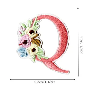 Embroidered letter Q patch with floral design, perfect for DIY clothing repair and decoration crafts.