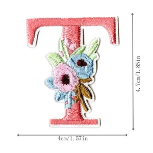 Embroidered letter T patch with floral design, colorful DIY decorative sewing applique.