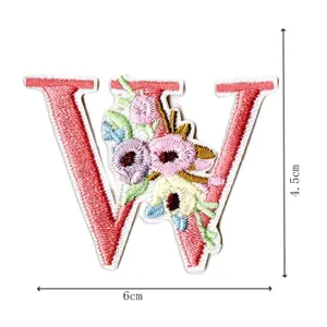 Embroidered letter W patch with colorful floral design, perfect for DIY clothing and accessories.