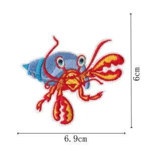 Cute cartoon hermit crab embroidered patch detail view, measuring 6x6.9cm, ideal iron-on.
