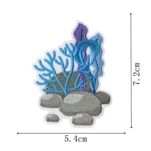Detailed view of coral and rock embroidery patch with clear dimension specs of 7.2 by 5.4 cm.