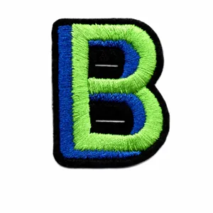 Close-up detail of the embroidered letter B patch with blue and green stitching on black fabric.
