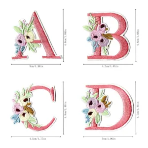 Embroidered letter patch with floral design, perfect for DIY clothing and accessories.