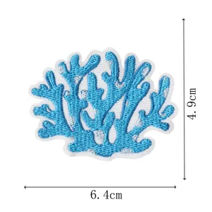 Close-up view of the blue embroidered coral patch showing fine thread details and precise size.