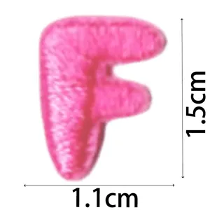 Pink letter F embroidered patch detail, cute DIY clothing accessory, 1.5x1.1cm size view.