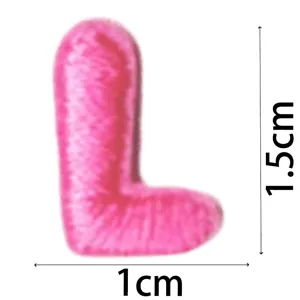 Pink embroidered letter L patch detail view, miniature fuzzy alphabet DIY clothing accessory.