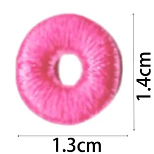 Pink circular embroidery patch detail showing dimensions of 1.3 by 1.4 cm for DIY decor.