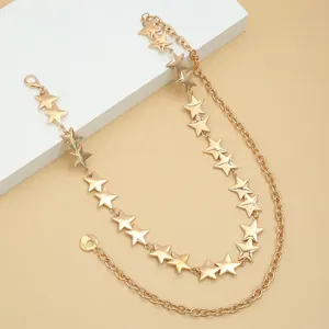 Gold double layer star waist chain detail shot, stylish metallic pants chain accessory.