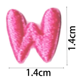 Detailed view of the cute pink letter W embroidered patch, mini size for DIY clothing.