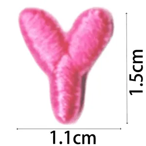 Pink letter Y embroidery patch close-up, mini DIY clothing accessory patch iron on.