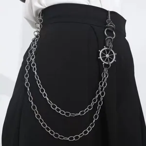 Close-up detail of punk style double layer metal pants chain featuring ship helm charm.