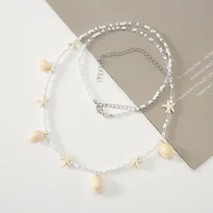Detailed view of the beach style shell and starfish beaded waist chain, exquisite craftsmanship.