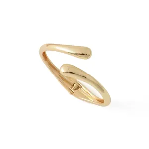 Gold open spring bangle bracelet with elegant waterdrop lines, minimalist fashion wrist jewelry.