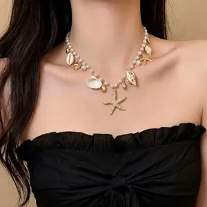 Bohemian summer beach shell choker necklace with artificial pearls starfish and conch pendants.