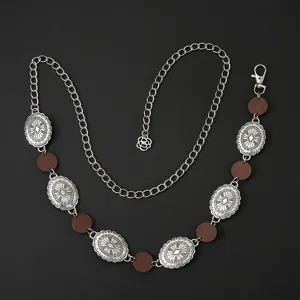Chaîne de taille en métal ethnique bohème avec des médaillons ovales sculptés et perles bois.